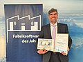 Managing Director Dr. Herbert Hadler received the renowned award for the best Factory Software of 2019 in Frankfurt. © GITO Verlag